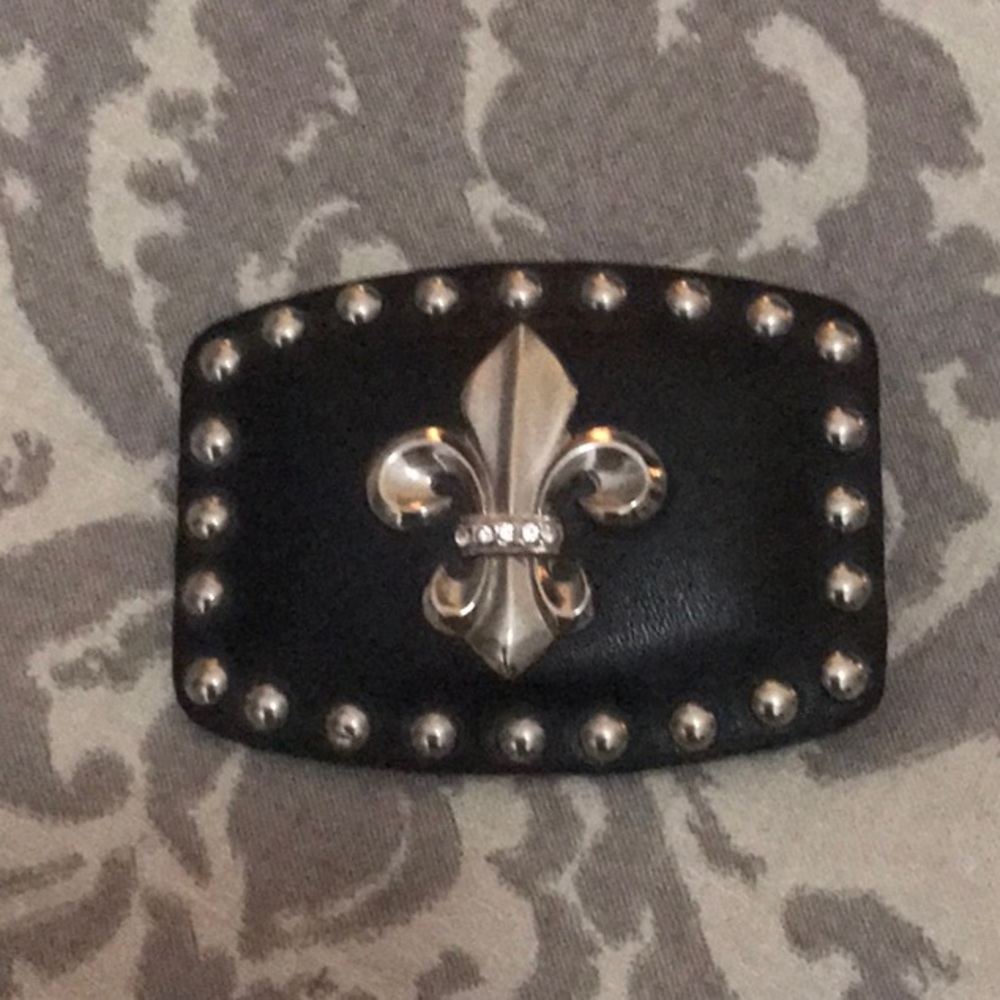 Women’s leather and silver belt buckle.